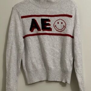 American Eagle Outfitters Gray Smiley Sweater with Red Accents